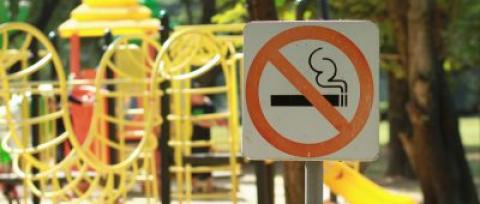 No,Smoking,Sign,Near,Children's,Playground,In,Public,Park